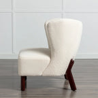 Poltrona senza braccioli in tessuto Sherpa con gambe in legno